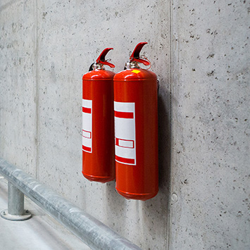Fire Extinguisher on a Concrete wall